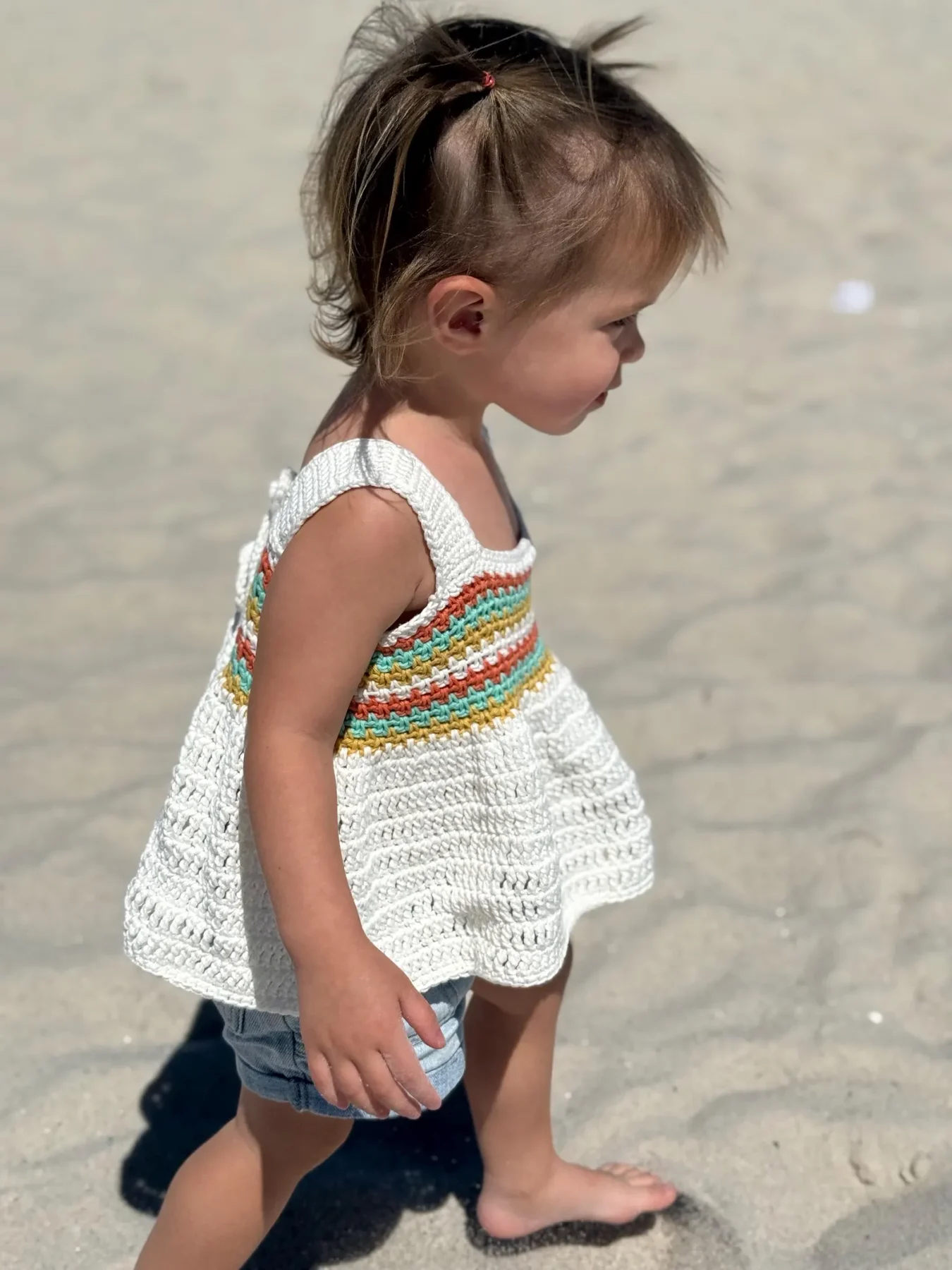Coastal Stripes tank with a rainbow bodice worn at the beach